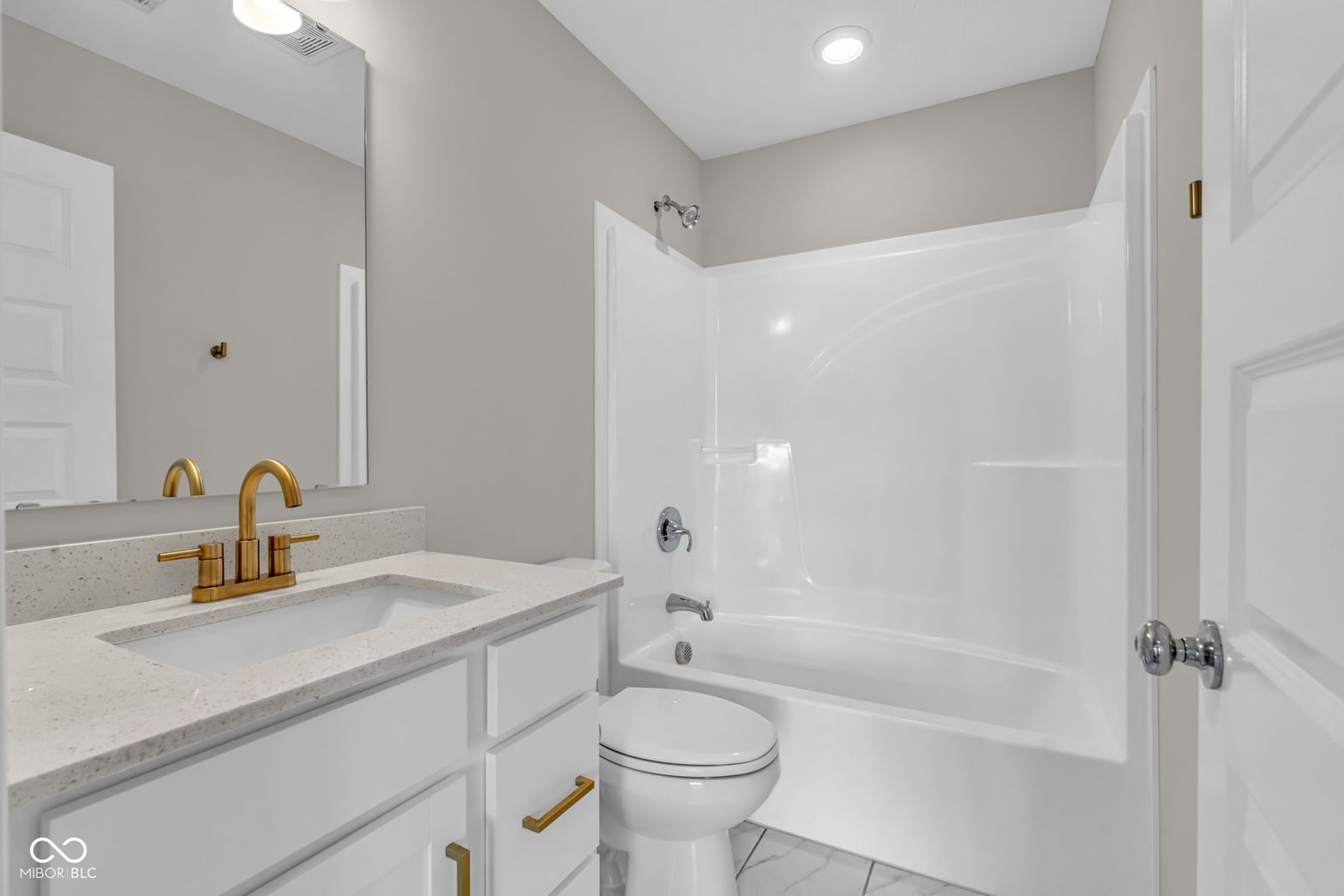 Luxurious primary bath with modern finishes and spa-like features.