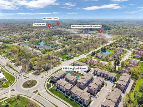 Aerial view at 659 Langford Street, Carmel, IN — New townhomes in vibrant community near parks and water.