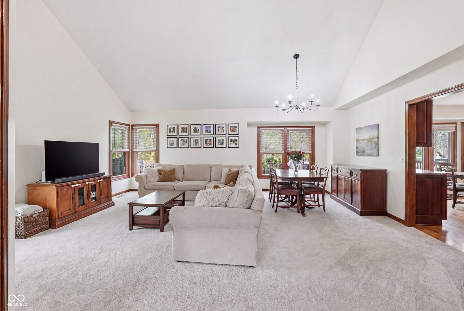 Spacious family room with vaulted ceilings and abundant natural light.
