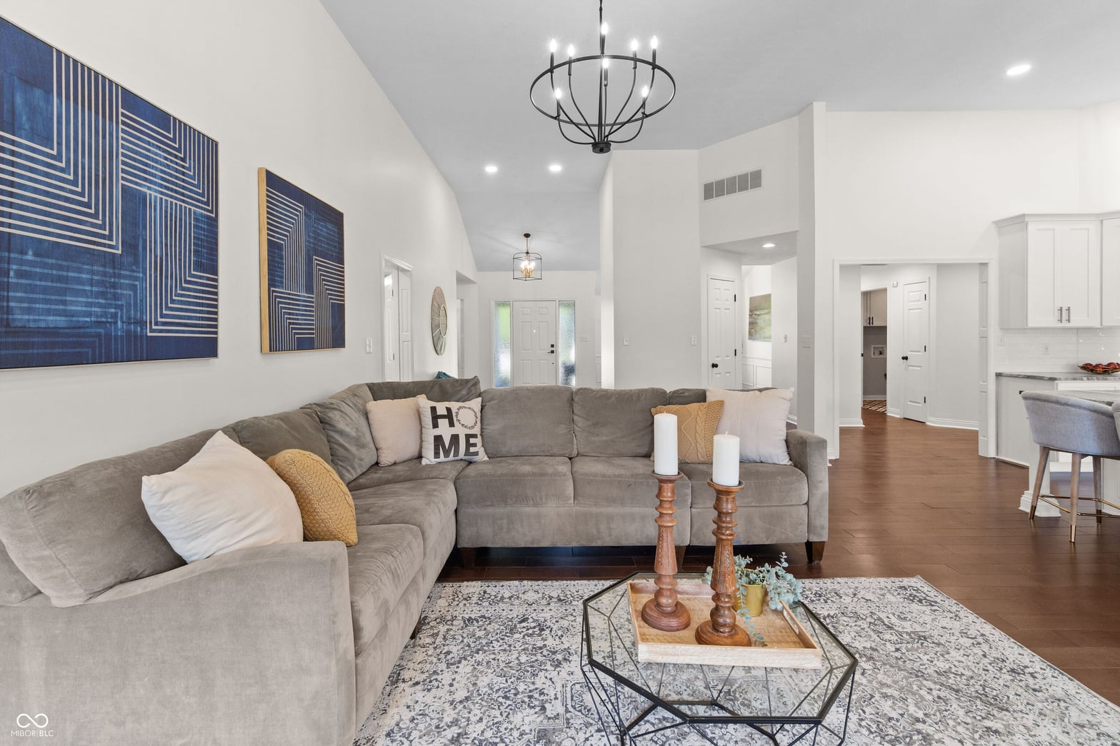 Bright, open family room with vaulted ceilings and hardwoods.