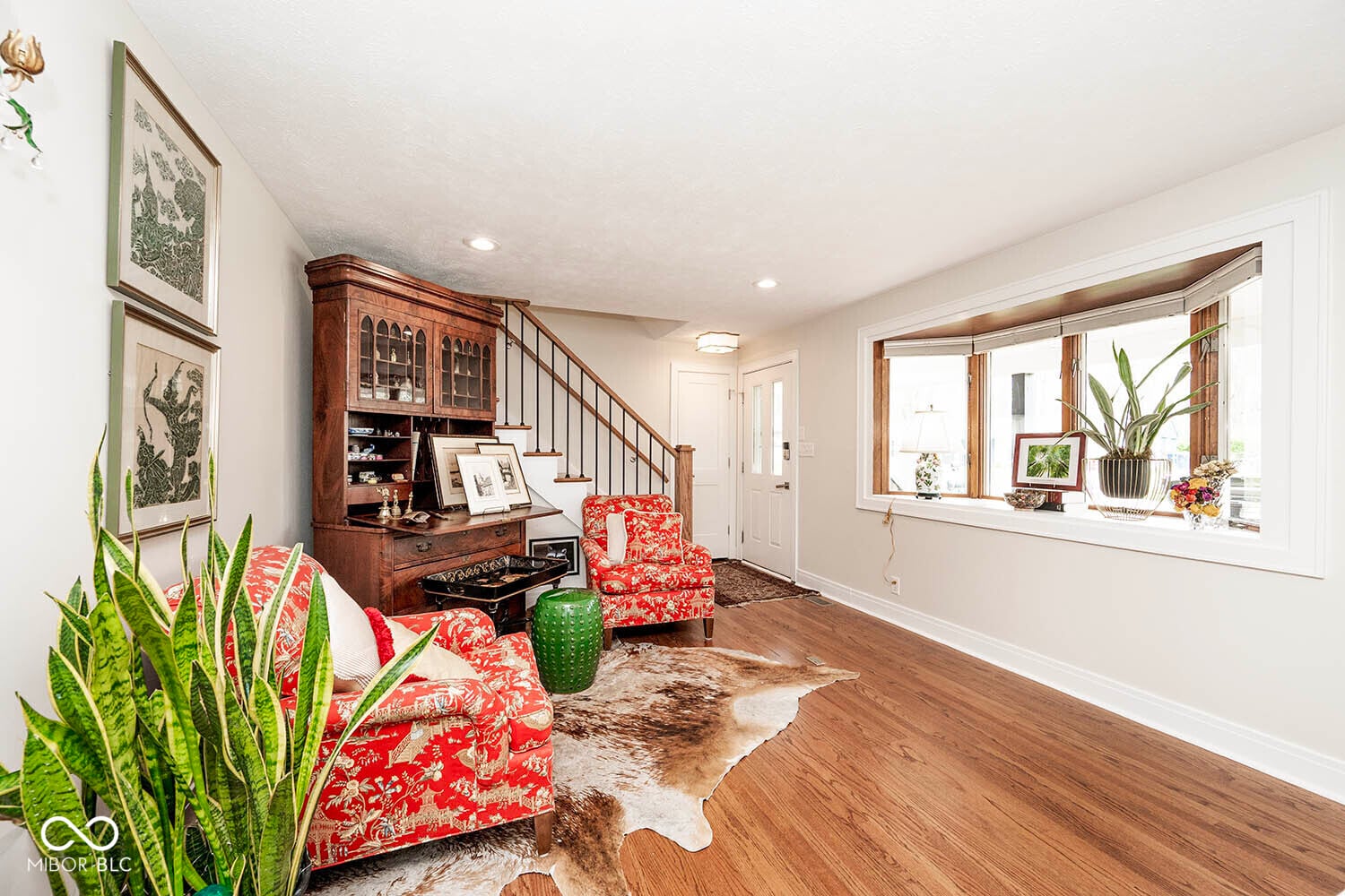 Bright family room with hardwood floors and built-ins.