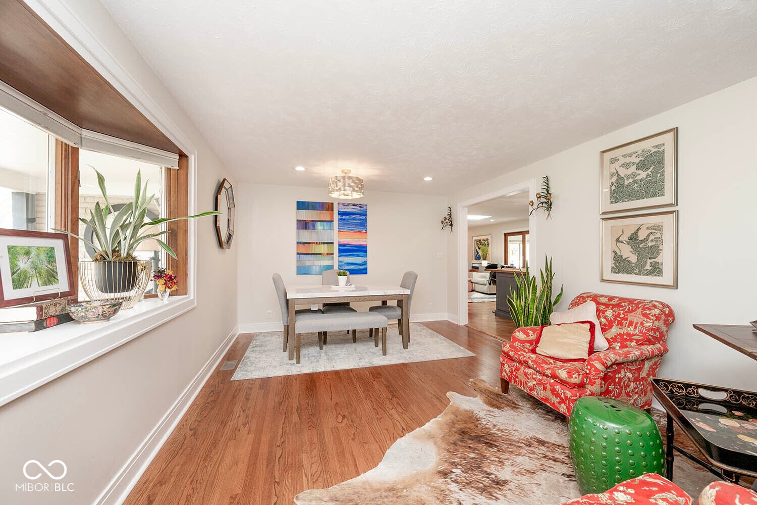 Bright, open living space with hardwood floors and natural light.