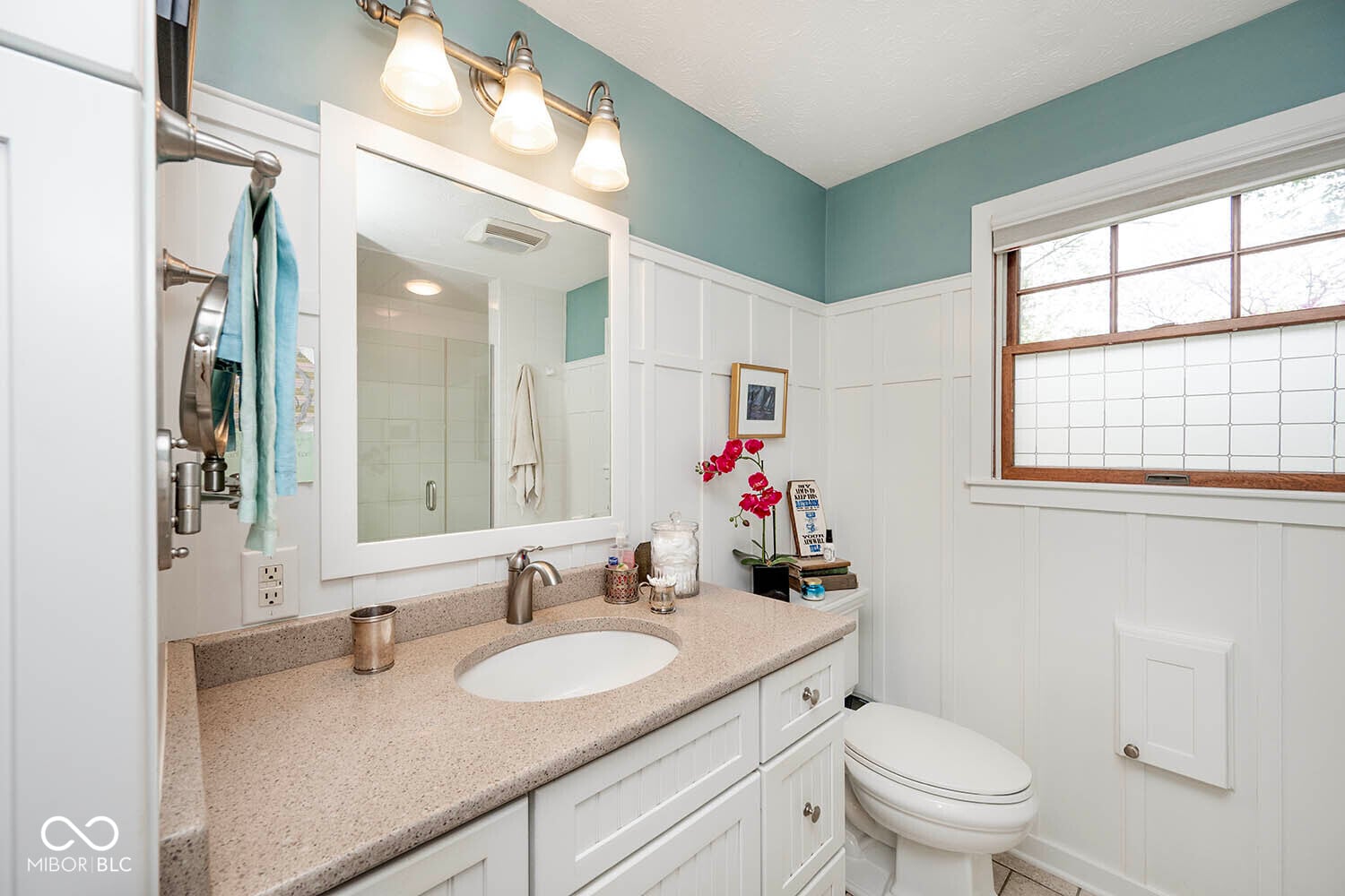 Bright spa-like bathroom with updated fixtures and finishes.