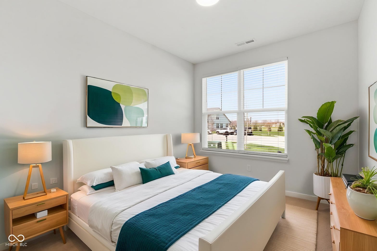 Bright, airy primary bedroom with abundant natural light.