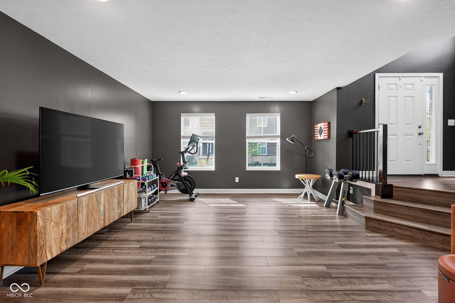 Spacious modern family room with premium hardwood floors.