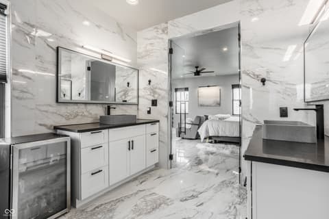 Primary bathroom at 13120 Broad Street, Carmel, IN — Luxurious spa-like bathroom with marble throughout
