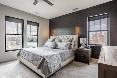 Primary bedroom at 13120 Broad Street, Carmel, IN — Luxurious primary bedroom with modern shiplap and elegance.