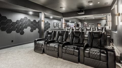 Bonus room at 13120 Broad Street, Carmel, IN — Luxury home theater with premium leather recliners.