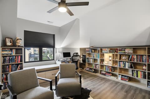 Bonus room at 13120 Broad Street, Carmel, IN — Bright bonus room with built-in shelving and skylights.