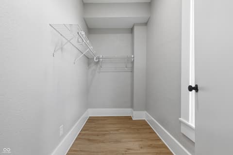 Bedroom at 350 S Broadway Street, Atlanta, IN — Spacious walk-in closet with organized shelving system.