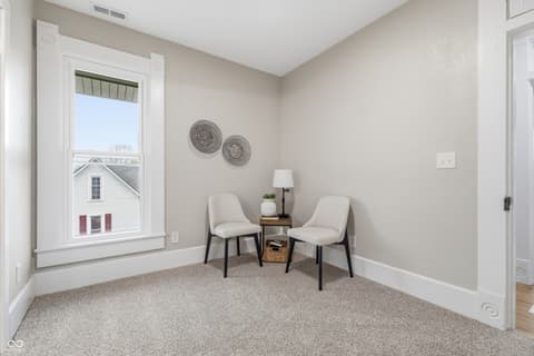 Bonus room at 350 S Broadway Street, Atlanta, IN — Bright bonus room with large windows and neutral finishes.