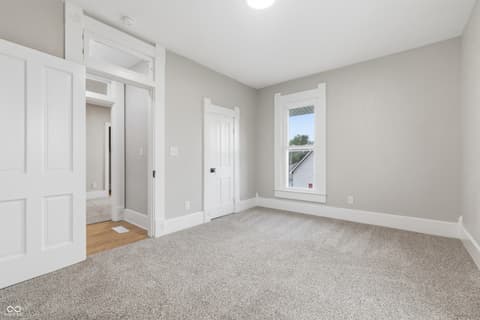 Primary bedroom at 350 S Broadway Street, Atlanta, IN — Spacious primary bedroom with walk-in closet and ensuite.