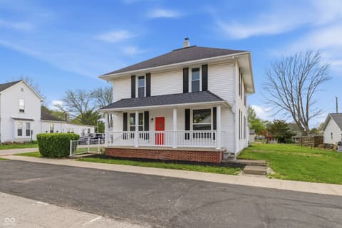 Front exterior at 350 S Broadway Street, Atlanta, IN — Classic farmhouse with inviting front porch and updates.