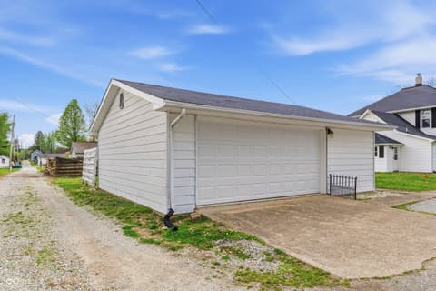 Garage at 350 S Broadway Street, Atlanta, IN — Clean two-car garage with modern panel door and driveway.