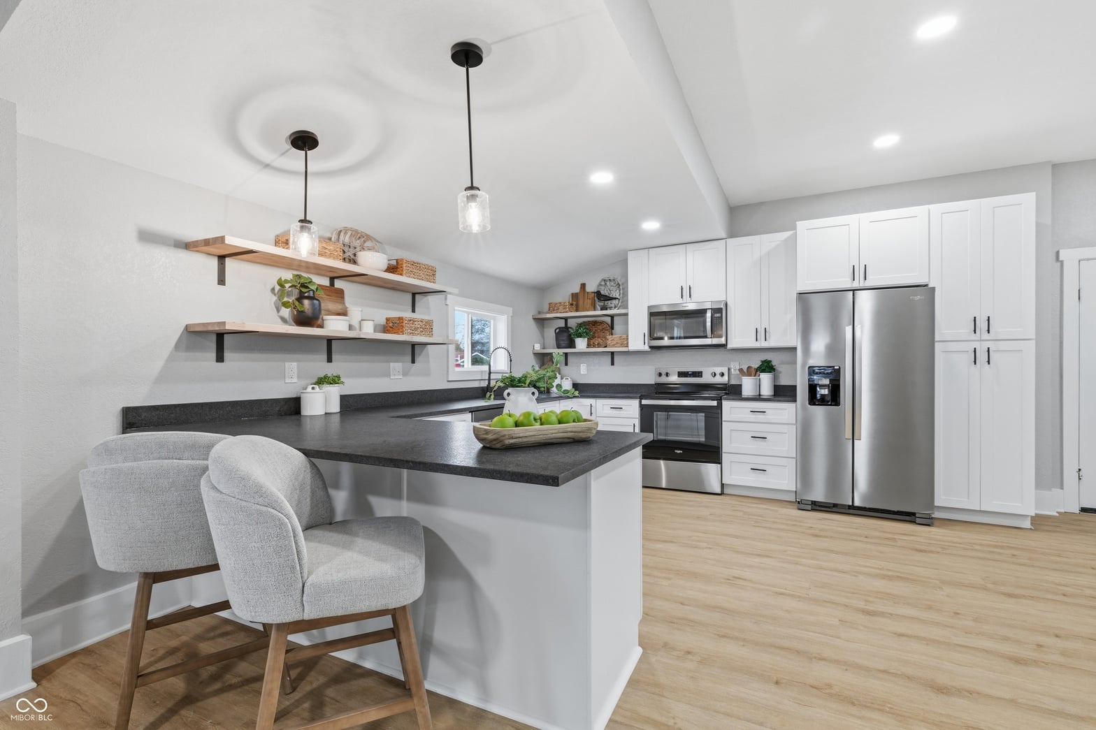 Kitchen at 350 S Broadway Street, Atlanta, IN — Stunning modern kitchen with island and open shelving.