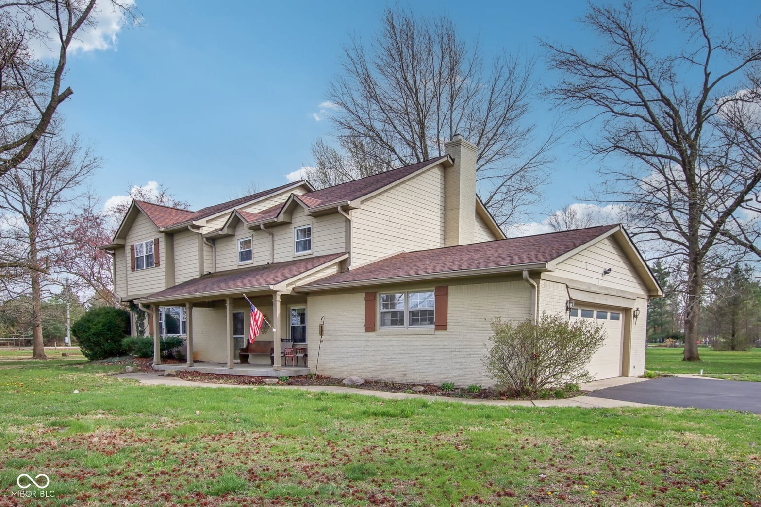 Spacious two-story colonial on expansive wooded lot.