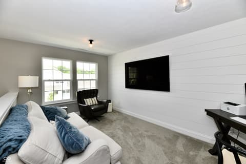 Bedroom at 9861 Bucklebury Lane, Carmel, IN — Bright bedroom with shiplap walls and modern amenities.