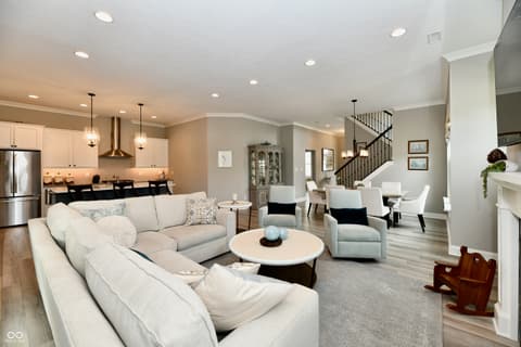 Family room at 9861 Bucklebury Lane, Carmel, IN — Bright open-concept living with premium finishes throughout.