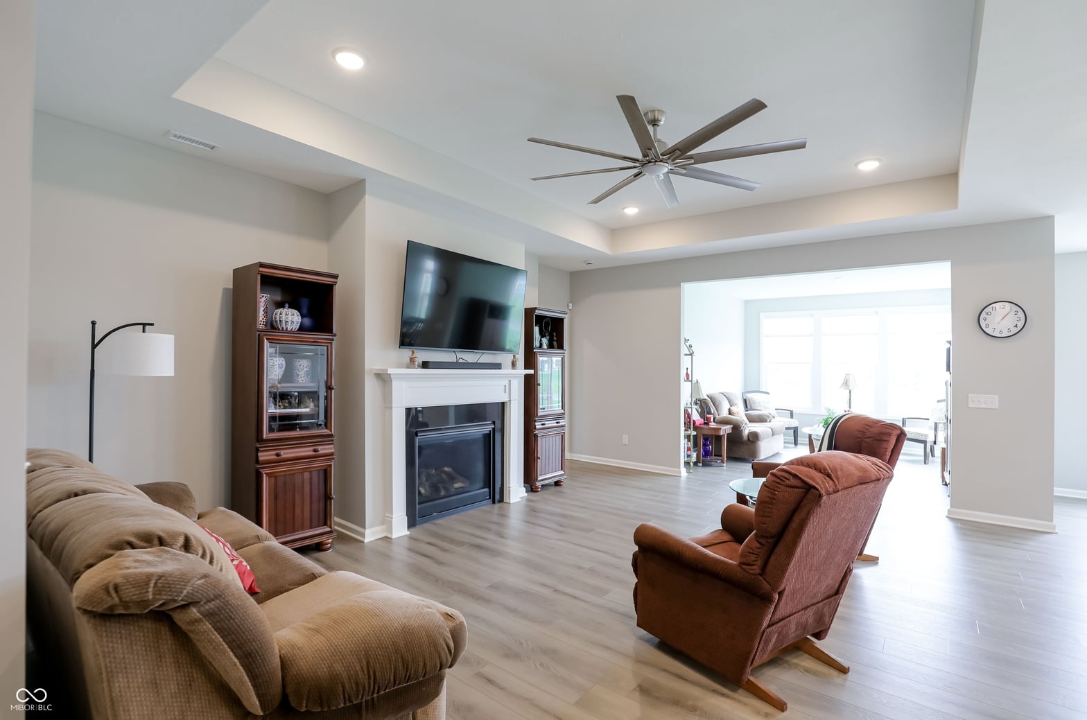 Spacious living room with fireplace and modern finishes.