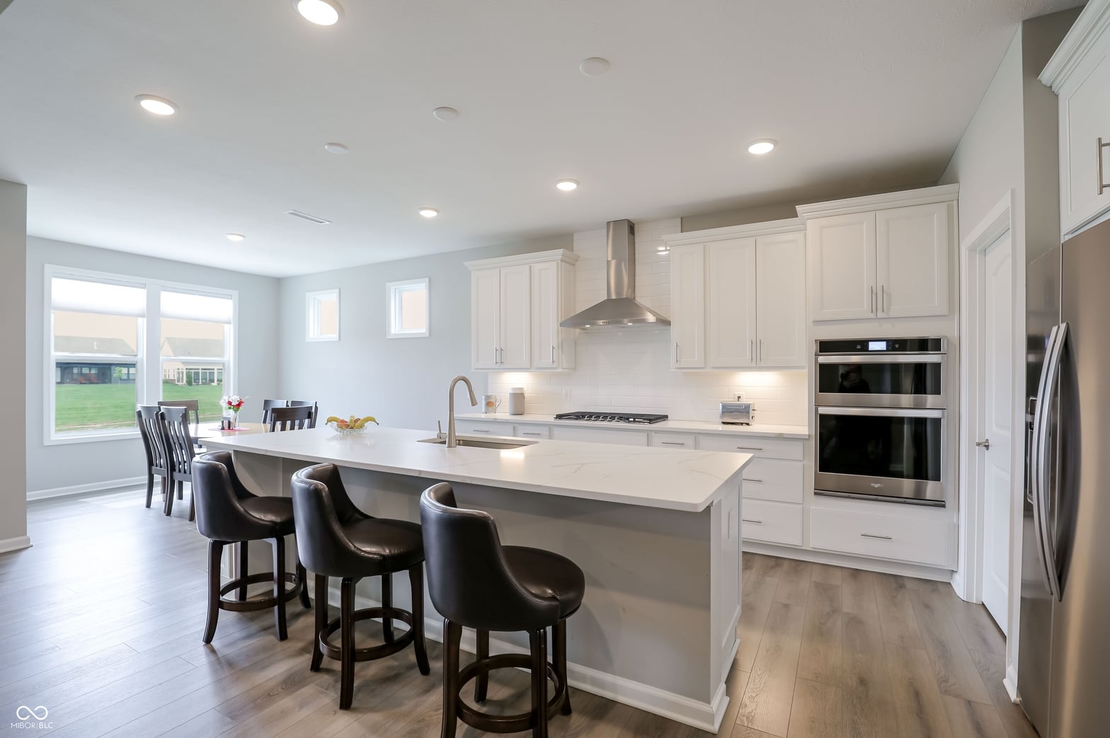 Bright modern kitchen with premium appliances and island seating.