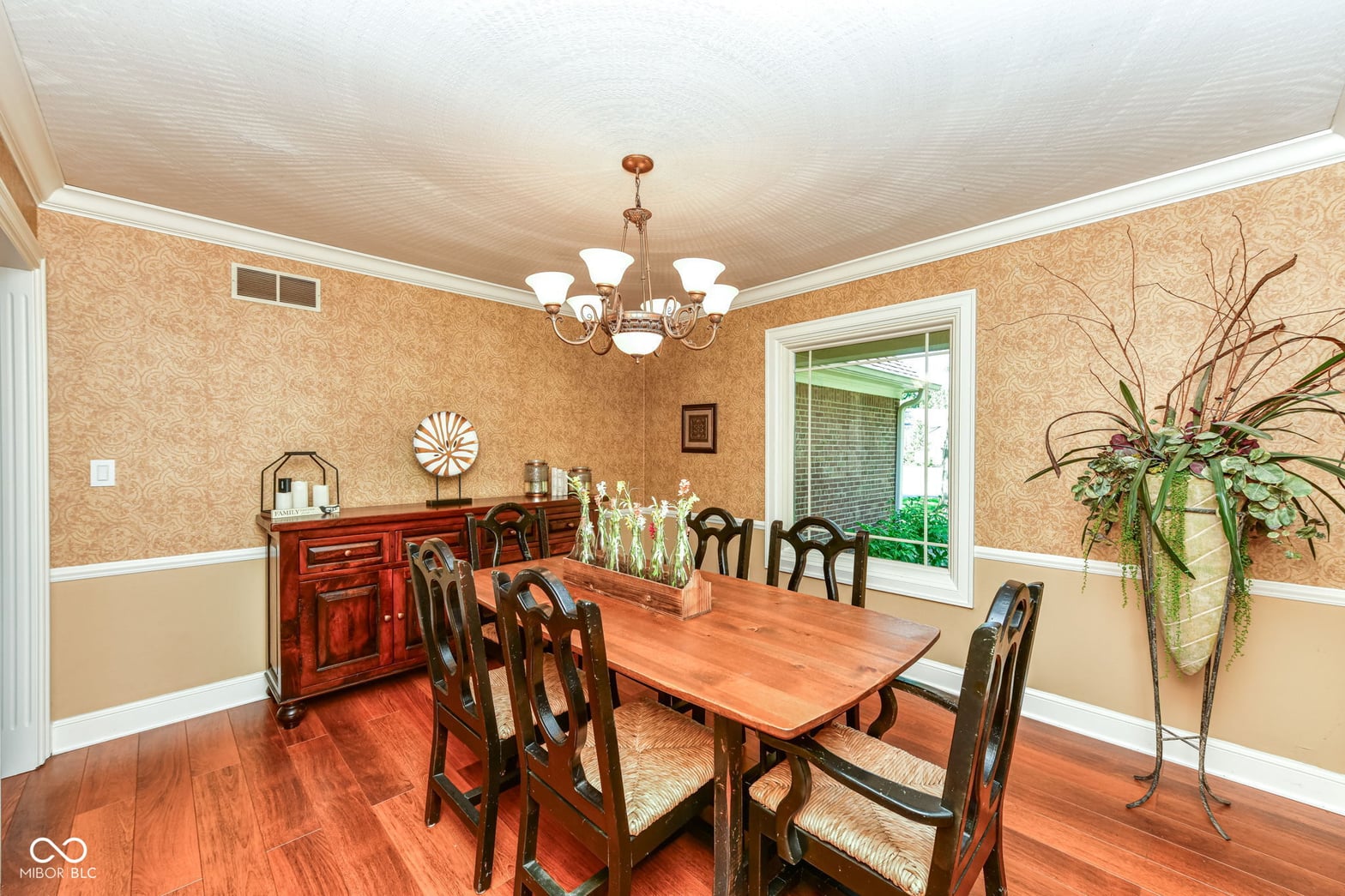 Elegant dining room with hardwood floors and classic details.