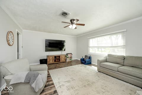Living room at 5469 W Village Drive, New Palestine, IN