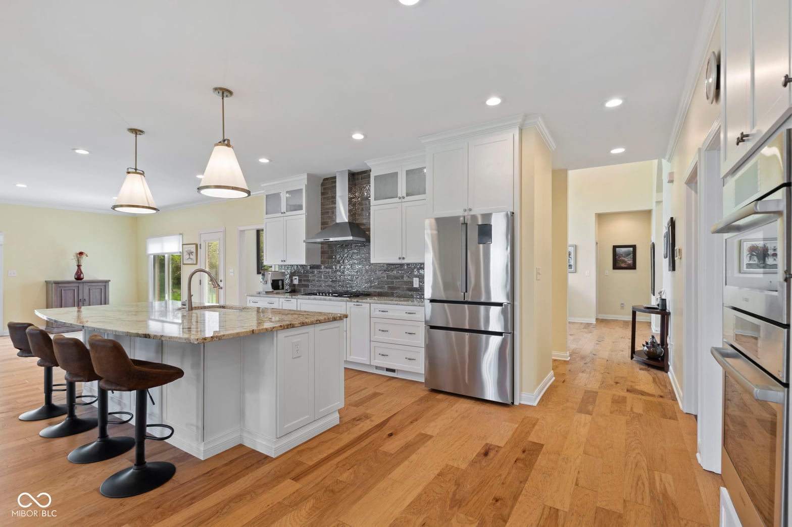 Spacious modern kitchen with premium finishes and island.