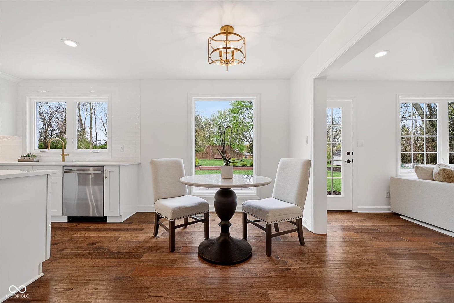 Bright kitchen with hardwood floors and abundant natural light.