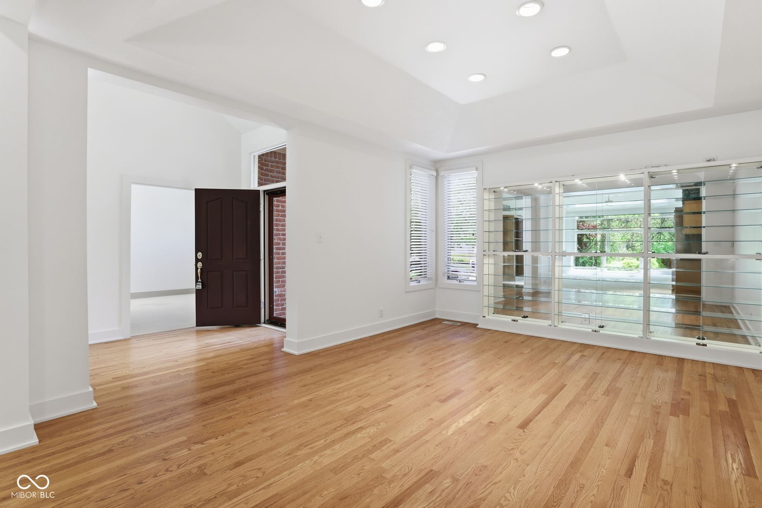Bright modern living space with gleaming hardwood floors.