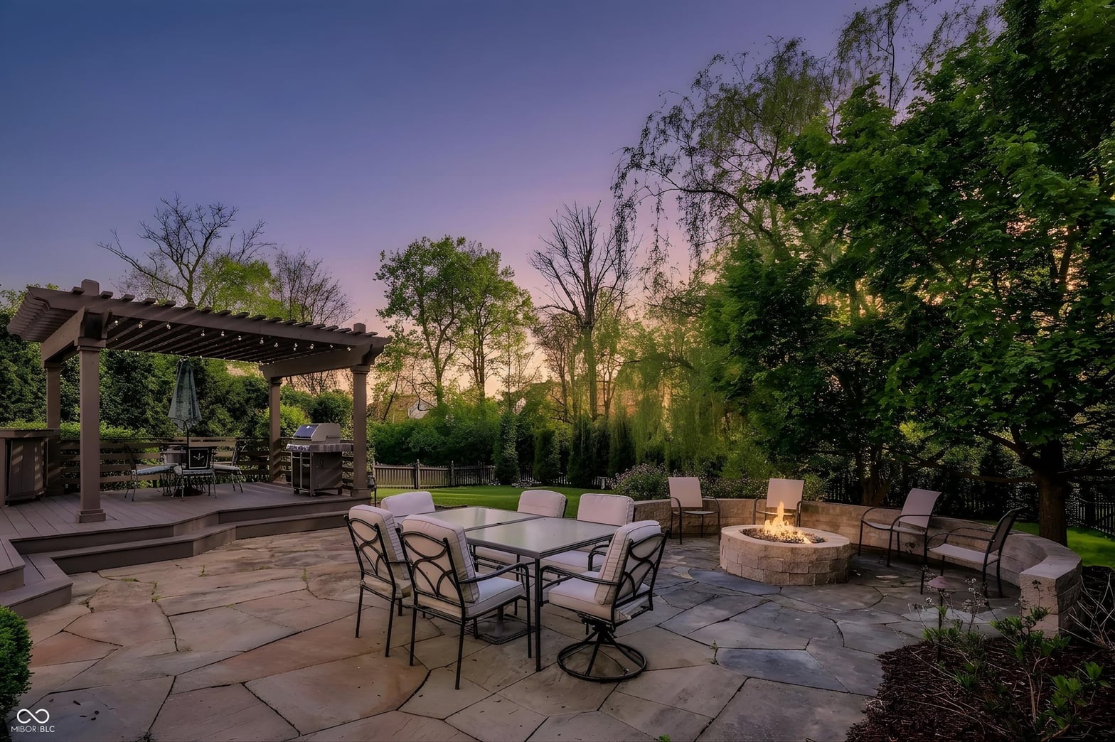 Stunning entertainer's patio with fire pit and pergola.