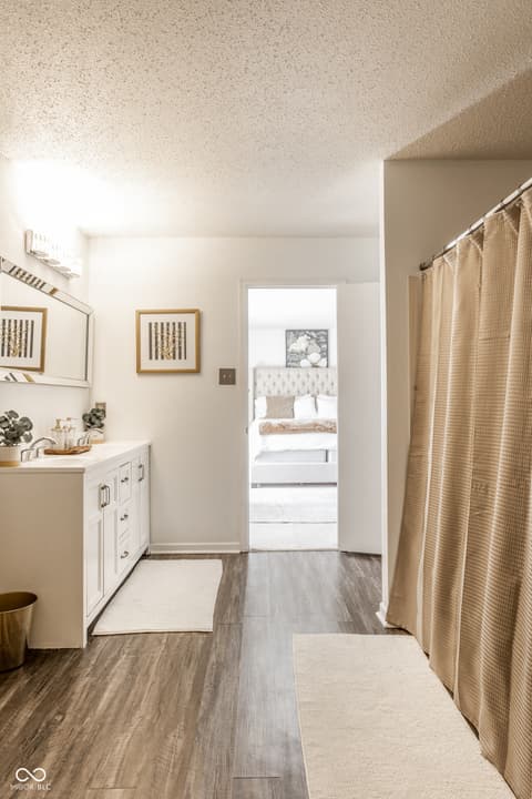 Primary bathroom at 12957 E 131st Street, Fishers, IN — Spa-like primary bath with dual vanity and modern finishes.