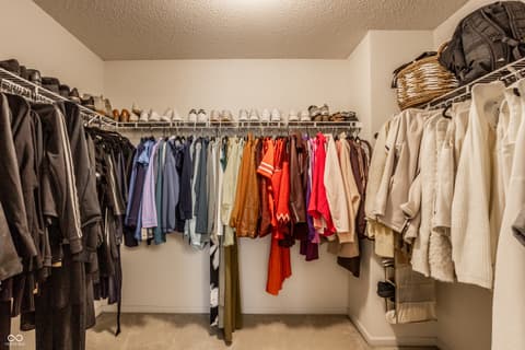 Closet at 12957 E 131st Street, Fishers, IN — Large walk-in closet with dual hanging rods and shelving.