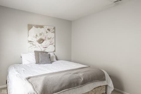 Bedroom at 12957 E 131st Street, Fishers, IN — Bright, neutral bedroom with modern finishes.