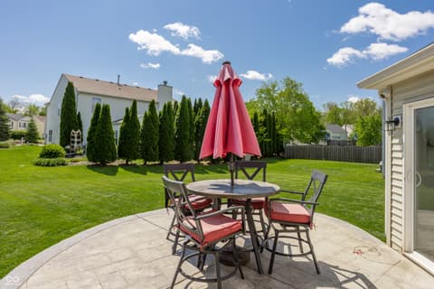 Outdoor living area at 12957 E 131st Street, Fishers, IN — Spacious backyard patio perfect for entertaining.