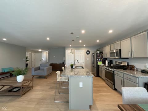 Kitchen at 19366 Goins Boulevard, Westfield, IN — Open-concept kitchen with granite island and modern finishes
