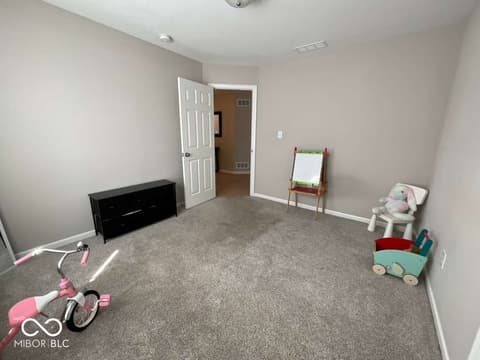 Bedroom at 19366 Goins Boulevard, Westfield, IN — Spacious bedroom with neutral decor and ample storage.