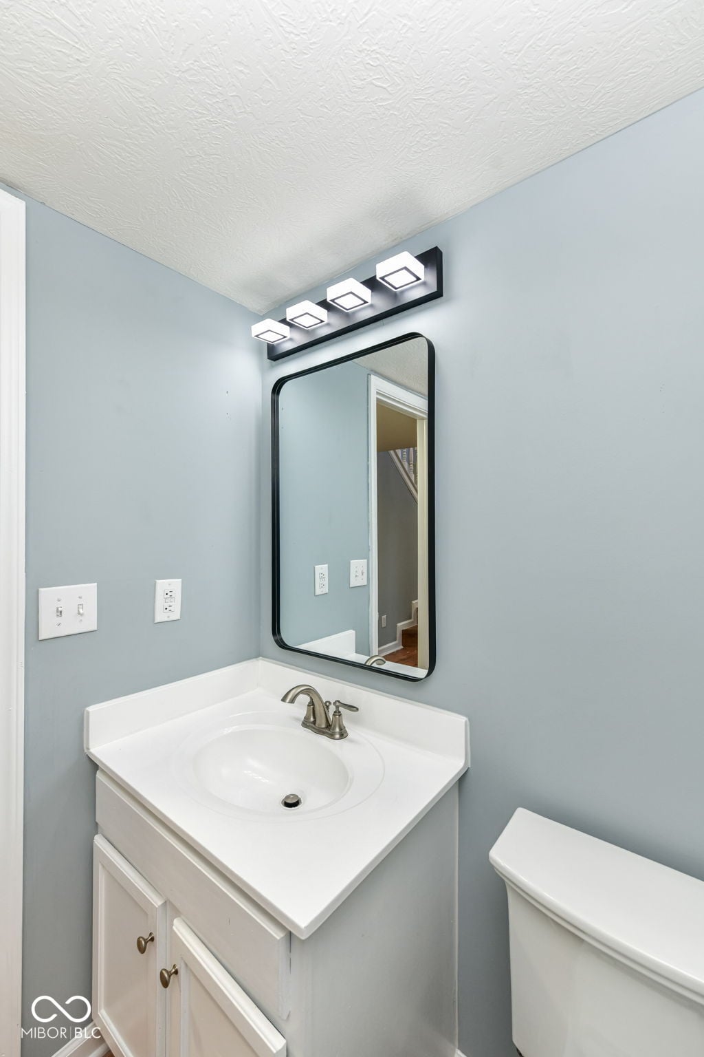 Modern bathroom with updated fixtures and contemporary styling.