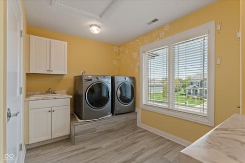 Laundry room at 13560 Limerick Drive, St John, IN
