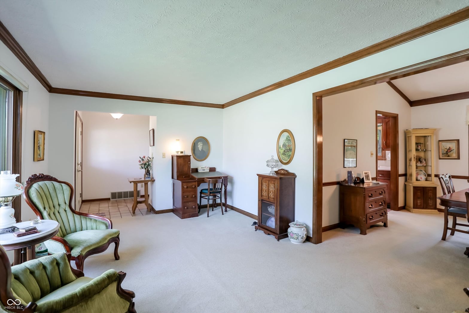 Spacious traditional bedroom suite with attached sitting areas.