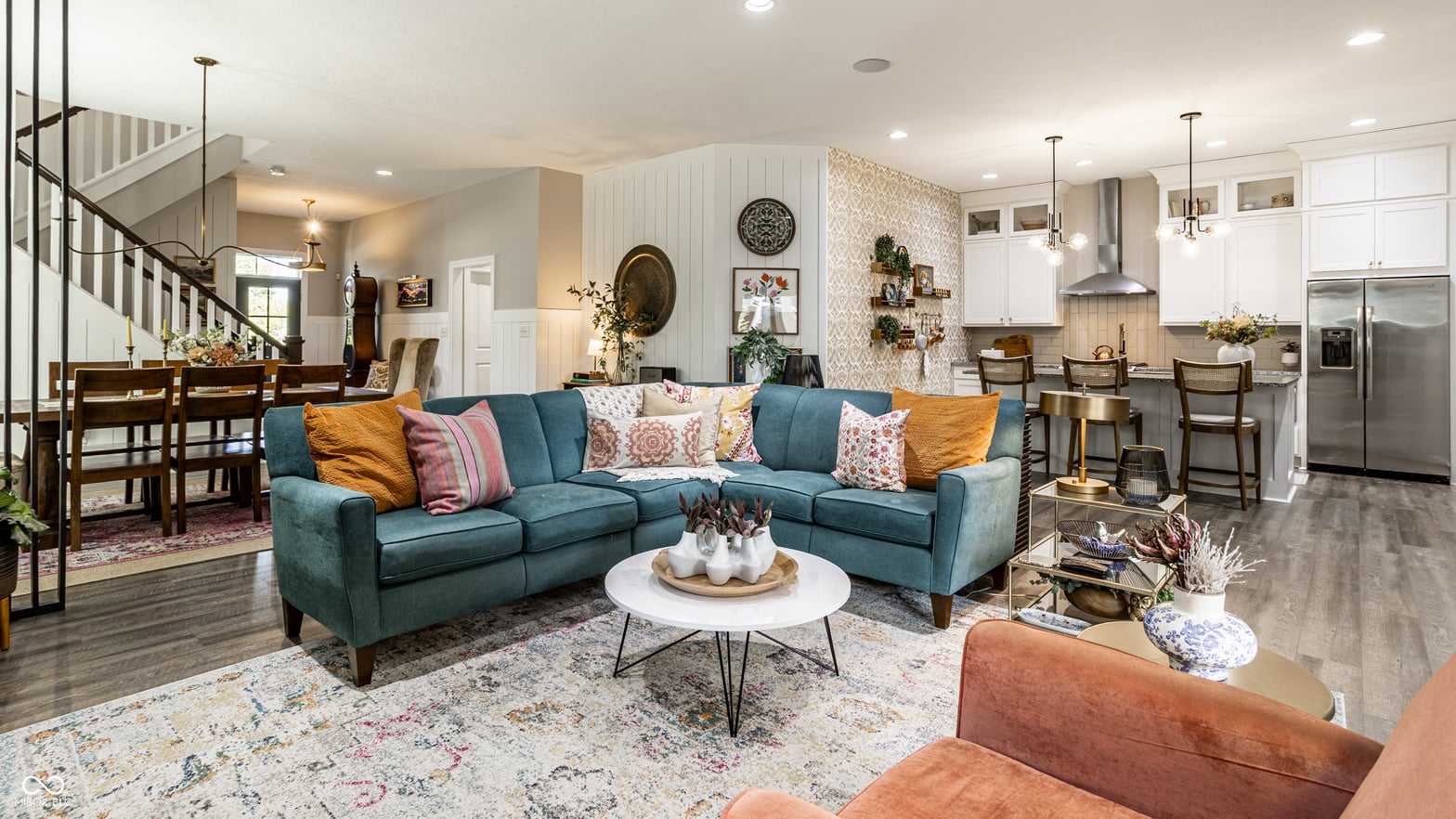 Stunning open-concept living with modern kitchen and spiral stairs.