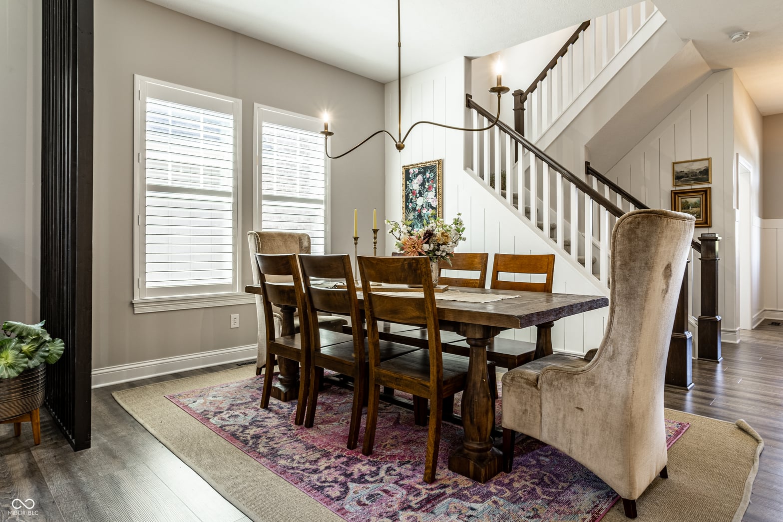 Elegant dining room with soaring ceilings and modern lighting.