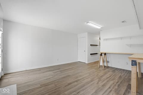 Bonus room at 6048 S Bay Drive, Indianapolis, IN — Bright open bonus room with modern shelving and work space.