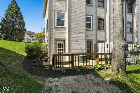 Backyard at 6048 S Bay Drive, Indianapolis, IN — Spacious backyard deck with mature trees and privacy.