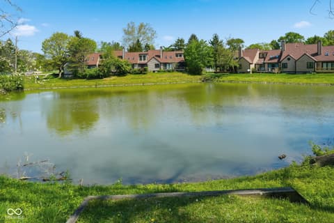 Backyard at 6048 S Bay Drive, Indianapolis, IN — Scenic waterfront property with expansive pond views.
