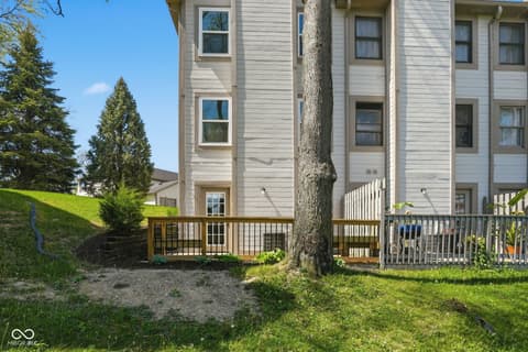 Backyard at 6048 S Bay Drive, Indianapolis, IN — Spacious backyard with mature trees and wooden deck.