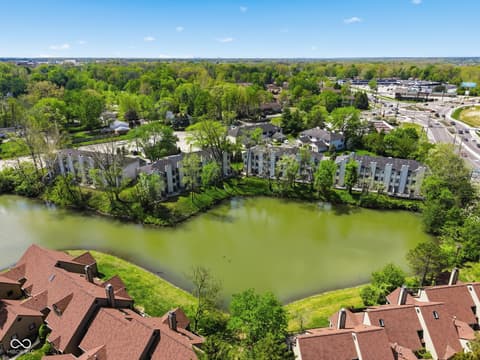 Aerial view at 6048 S Bay Drive, Indianapolis, IN — Waterfront community with mature trees and pond views.