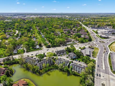 Aerial view at 6048 S Bay Drive, Indianapolis, IN — Waterfront community with mature landscaping and pond views.