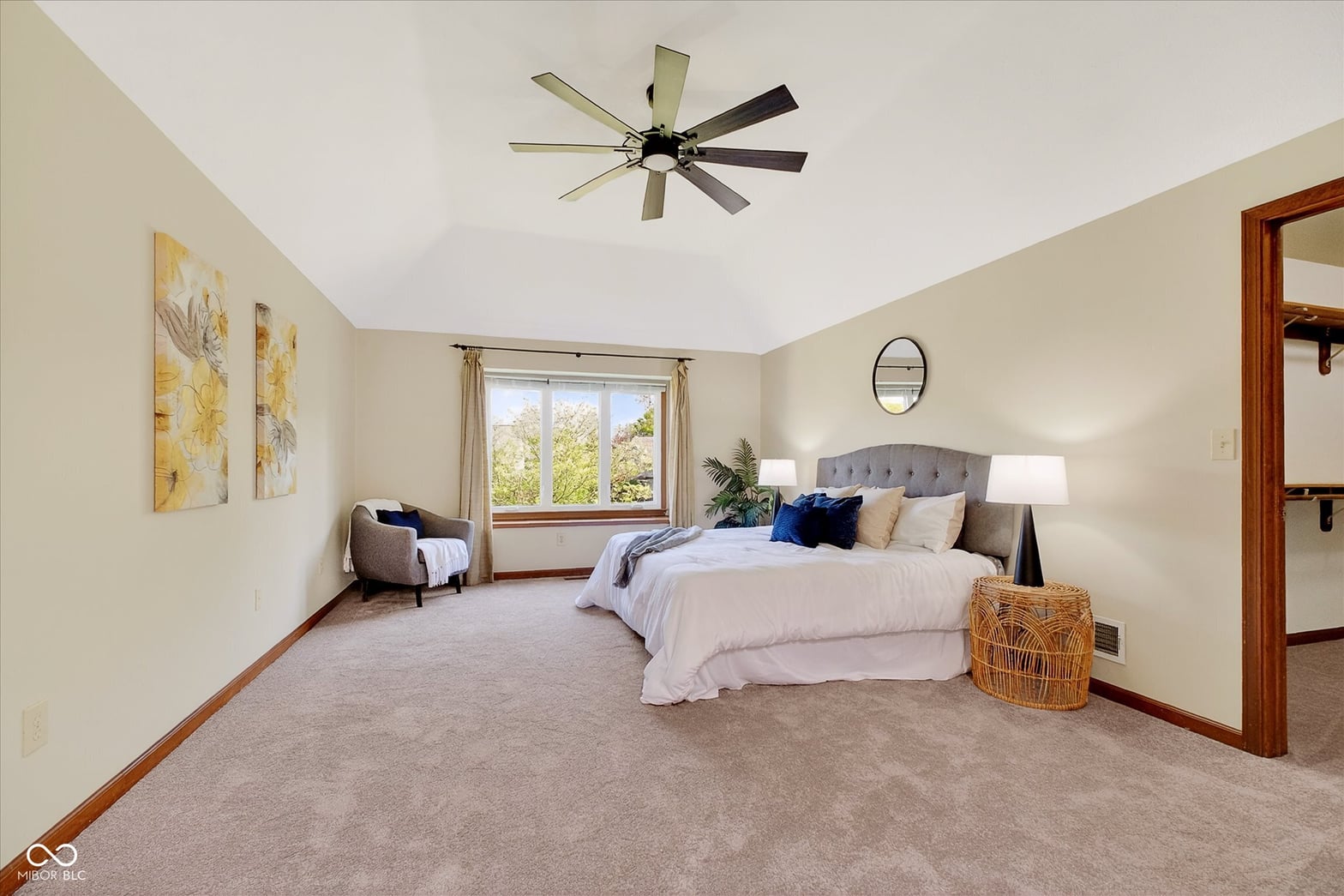 Spacious primary suite with abundant natural light and modern amenities.