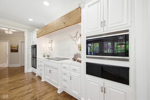 Kitchen at 7436 Glenvista Place, Fishers, IN — Luxurious renovated kitchen with marble and stainless steel.