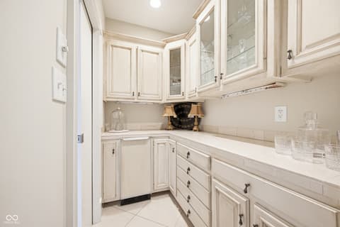 Kitchen at 7436 Glenvista Place, Fishers, IN — Bright, classic kitchen with elegant white cabinetry.